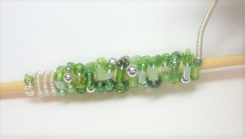 Judy Larson's Coiled, Beaded Slide - , Contemporary Wire Jewelry, Coiling, Coiling Wire, Wire Coiling, Push the coil and bead firmly against the bead section